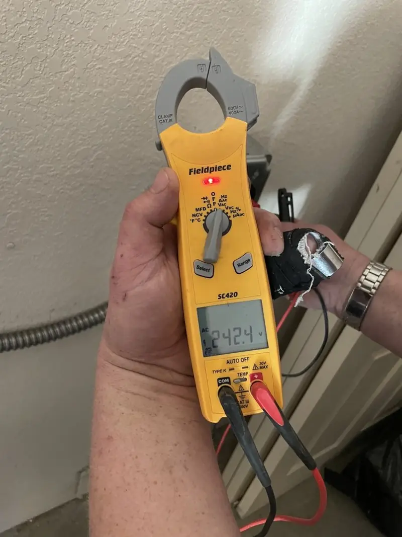 Voltage testing with clamp meter during Circuit Breaker Repair in Wayne